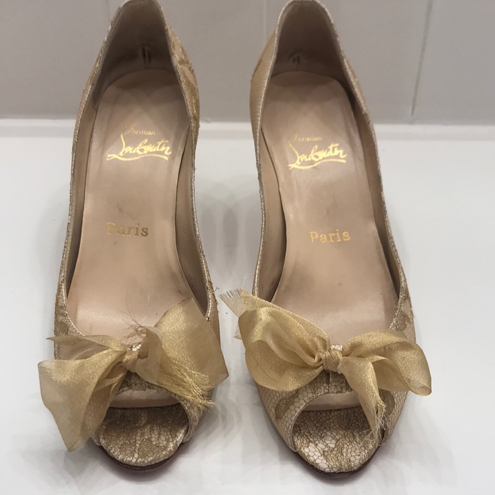 Louboutin cream and gold “Moon Bow” pumps